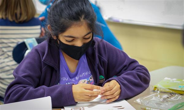 Student works on food model